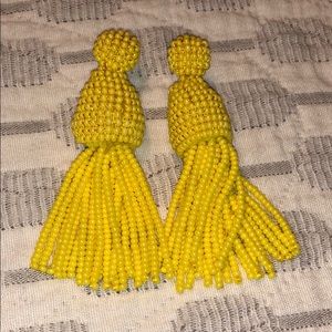 Yellow tassel earrings.
